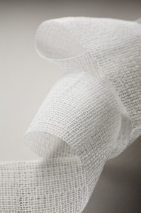 For casts that protect broken bones while they heal, AEC Narrow Fabrics adds to polyester fabric a resin that softens with water and then dries to a hard finish. Photo: AEC Narrow Fabrics