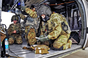 U.S. Army Pfc. Laci Lognion, right, inventories her medical equipment while U.S. Army Capt. Ivonne Cartagena, center, adjusts medical items during a pre-flight exercise on Jalalabad Airfield in Afghanistan  in 2013. They were assigned to the 101st Airborne Division's Company C, 2nd Battalion, 149th General Support Aviation Brigade, 1st Brigade Combat Team. U.S. Army photo by Sgt. 1st Class John D. Brown. 