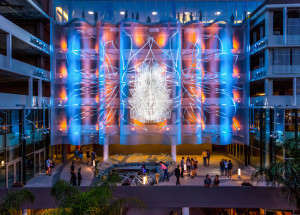 Cascade Architectural's Fabricoil™ coiled wire fabric system serves as both a canvas for a new work of art and the façade for the parking garage of The Vermont, a luxury high-rise apartment complex in Los Angeles. The parking garage project was completed in January 2015. Photos: “Los Angeles Opens its Heart of Compassion” ©Cliff Garten Studio/Photography by Jeremy Green.