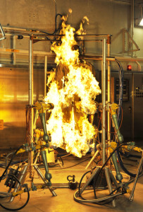 At the U.S. Army Natick Soldier Research, Development and Engineering Center in Natick, Mass., garments on a mannequin with 123 skin sensors are engulfed in flames to predict burn injury and interactions between clothing components. Photo: U.S. Army Natick SRDEC