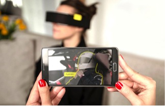 Friends can interact with the user’s VR surroundings using a smart phone. 