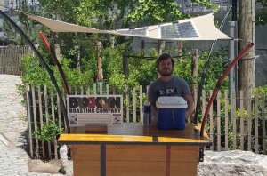 A flexible composite that includes integrated photovoltaic collection panels shades a portable iced coffee station in Brooklyn. Photo: Pvilion